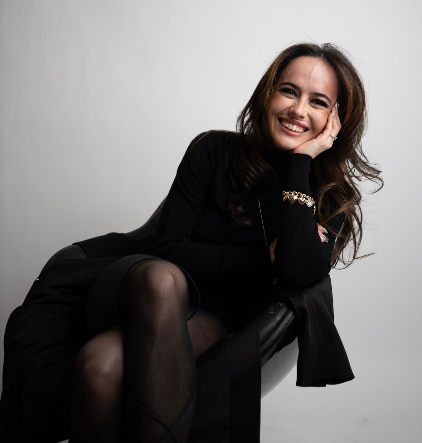 Dilya, founder of Amor Dance, seated portrait